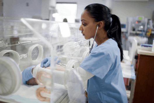 Nurses taking care of premature infants in NICU